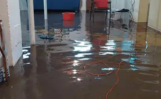 Basement with boiler, cabinets and washing machine completely flooded in {city}, {state}
